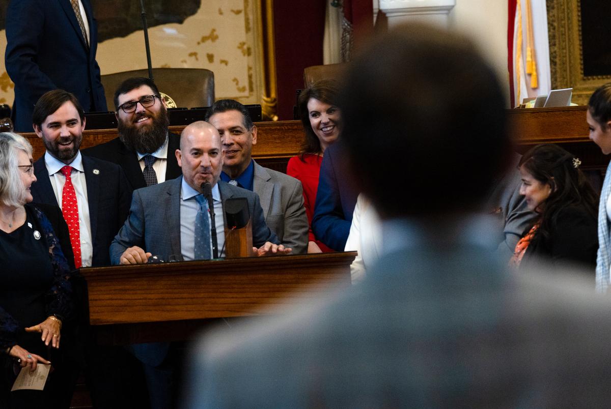 State Rep. Carl Tepper, R-Lubbock, yields for a round of hazing questions as his colleagues gather to support his first House bill during session on the House floor at the state Capitol in Austin on April 25, 2023.