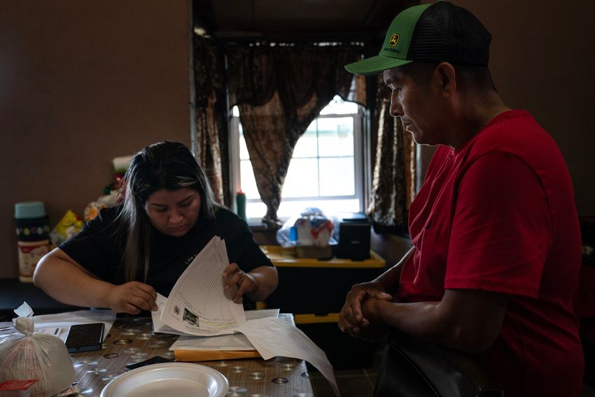 Geovanna Galván, 29, goes through her dad’s Jaime Galvan-Sánchez paperwork at their home in Mercedes, Texas on March 12, 2025. His ankle monitor was removed during that first appointment. 
Gabriel V. Cárdenas for The Texas Tribune