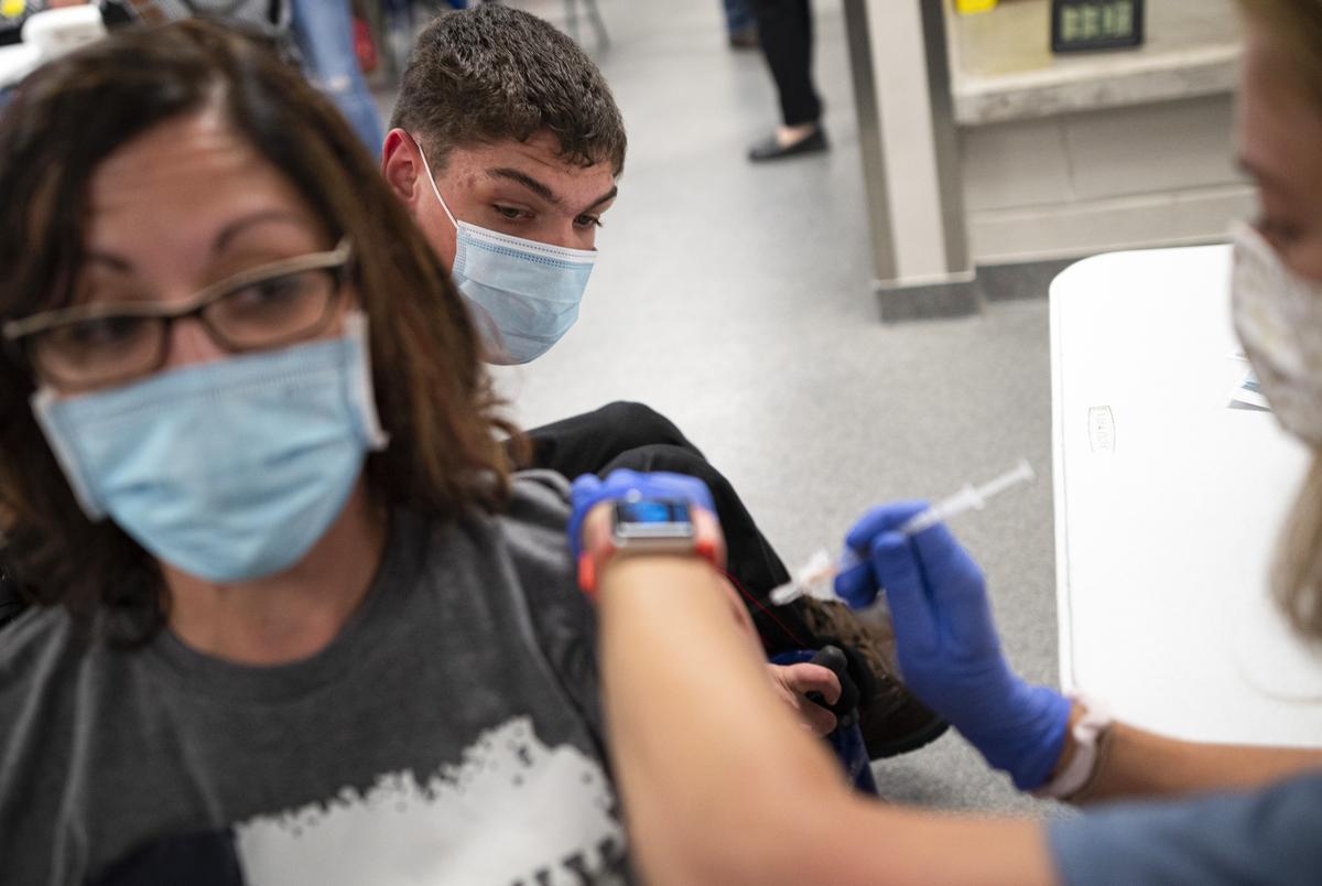 inside a locker room at the McKinney ISD Stadium and Community Event Center in McKinney, Texas. The Pfizer vaccinations were for McKinney ISD students ages 12 and older and their parents or legal guardians.