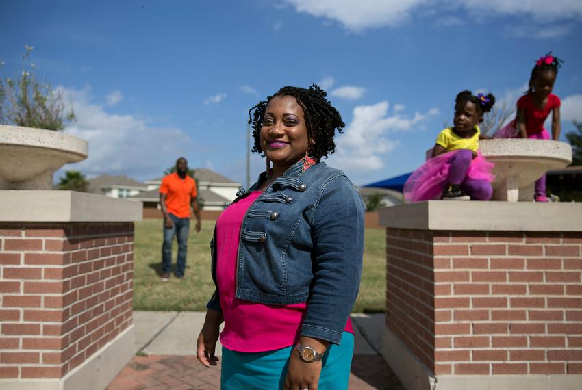 Syreeta Lazarus poses for a portrait while at the park with her family. Lazarus has recovered from multiple complications after giving birth. She credits knowing her body well enough to have noticed warning signs.