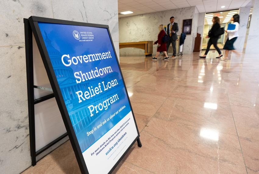 A sign advertises a government shutdown relief loan program outside of the United States Senate Federal Credit Union branch office in the Hart Senate Office Building in Washington on Tuesday, Sept. 30, 2025.
