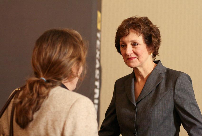 Susan Combs, Texas Comptroller of Public Accounts, speaks with a member of the audience during TribLive, a monthly conversation with public officials held by the Texas Tribune.