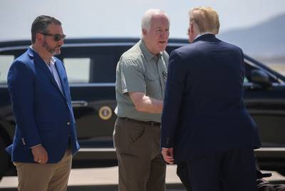 President Donald Trump is greeted by U.S. Sens. Ted Cruz and John Cornyn as he arrives at El Paso International Airport on August 7, 2019.