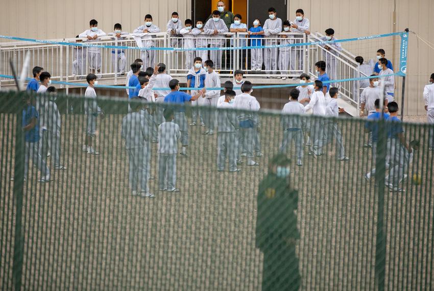 Unaccompanied migrant boys during the one hour they get for exercise at the CBP migrant processing center in El Paso on March 29, 2021.