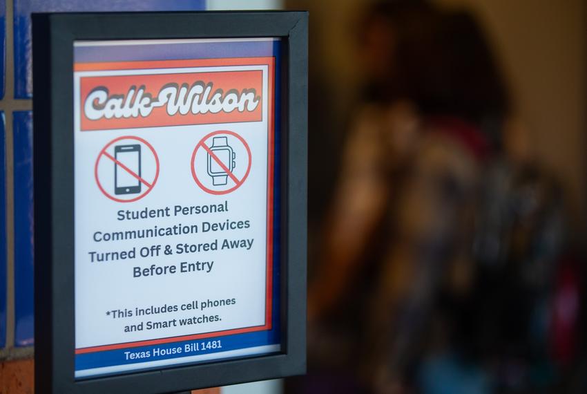 A sign depicting the Corpus Christi Independent School District's new cell phone policies is shown outside Calk-Wilson Elementary School in Corpus Christi, Texas, on Aug. 11, 2025.