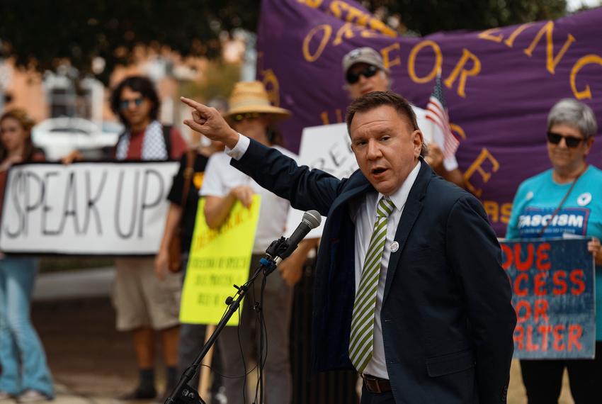Thomas Alter delivers speaks at a rally calling for him to be reinstated in downtown San Marcos on Sept. 25, 2025. The Texas State University professor was fired by the university for remarks he made at a virtual conference put on by a socialist group.