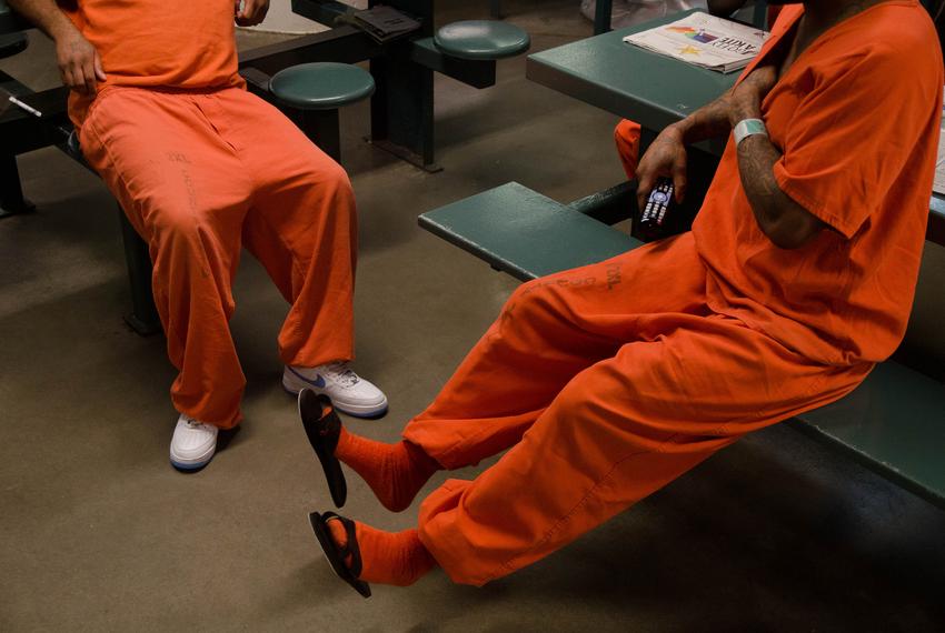 Inmates chat inside a cell block at the Harris County Jail.