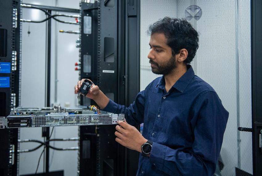 Graduate student Sai Abhideep Pundla holds a cooling fan that helped cool a Supermicro SYS-1029GQ-TVRT sever at The University of Texas at Arlington on Friday, Sept. 12, 2025 in Arlington, Texas. The fans are now being replaced by liquid cooling cold plates that would be more effective in cooling and produce less noise.