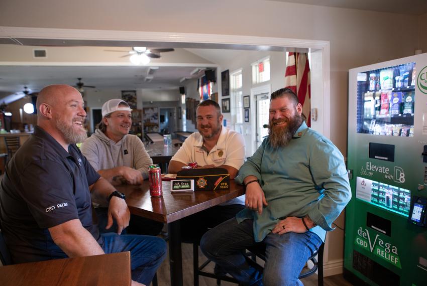 From left: Chris Bentler, Scott Vanlandingham, Dave Walden, and John Jowers chat at a table inside the VFW post in Leander on Nov. 1.