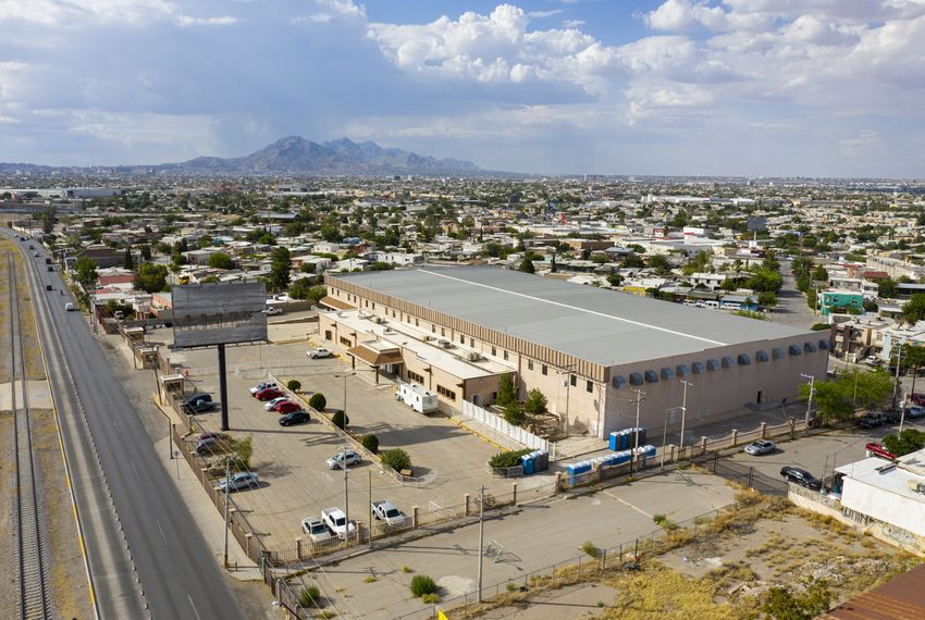 Mexican officials have turned an empty factory in Ciudad Juárez into a temporary shelter to hold migrants who have been arriving in large numbers to the border city across from El Paso.