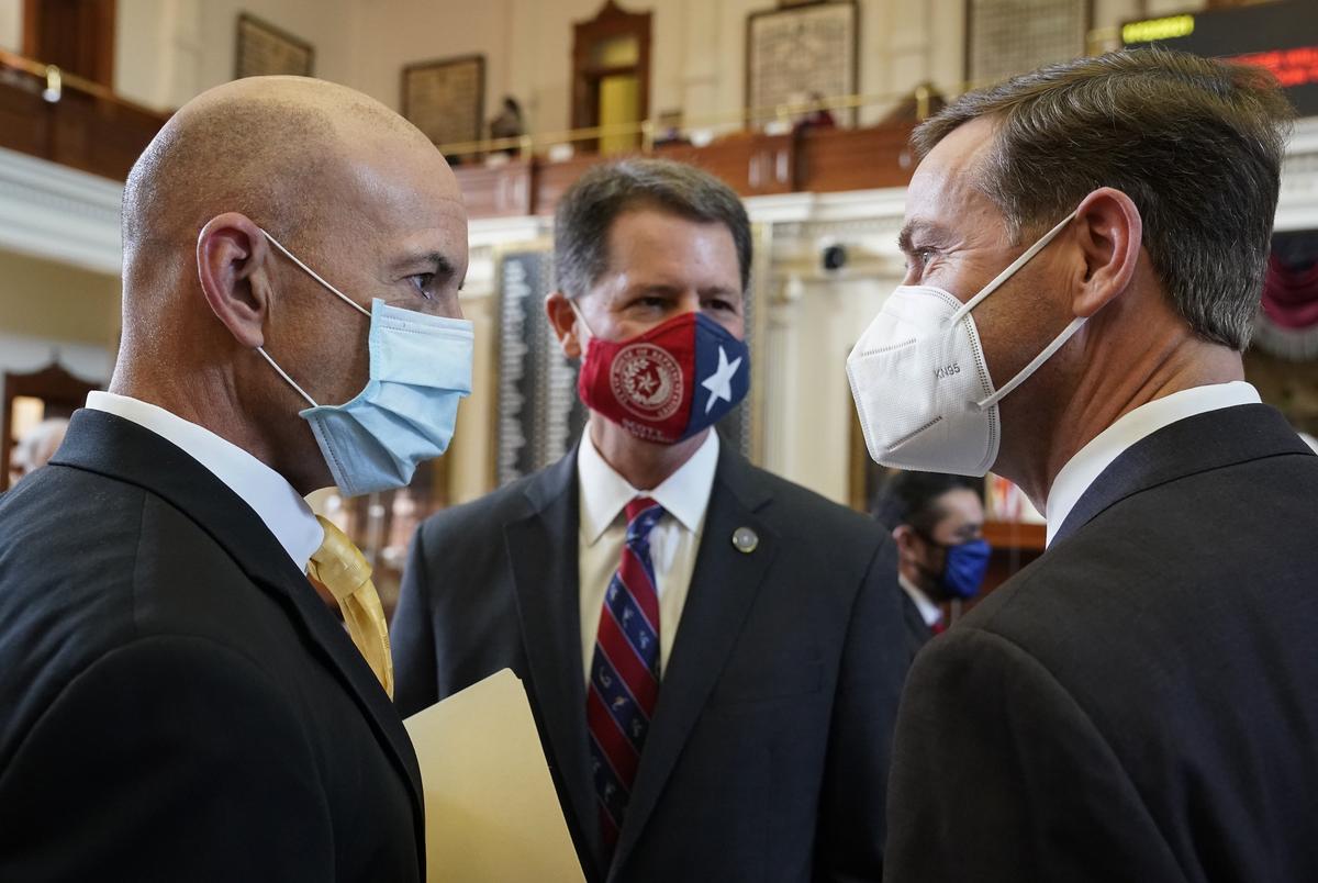 From left: state Rep. Matt Shaheen, R-Plano; Rep. Scott Sanford, R-McKinney; and Rep. Trent Ashby, R-Lufkin, meet as legislators greet each other on the House floor prior to the opening of the 2021 Legislature.