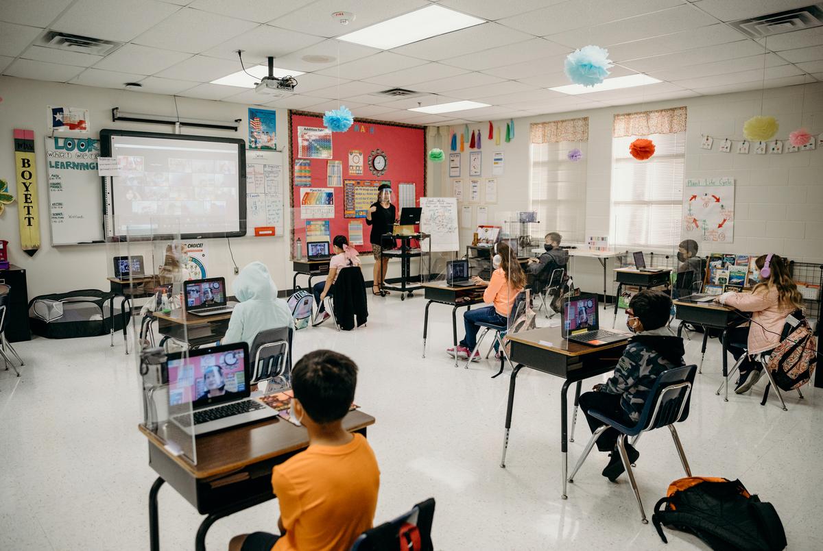 Plexiglass and six feet of distance between each desk keep students socially distant in Abigail Boyett's third grade classroom.
