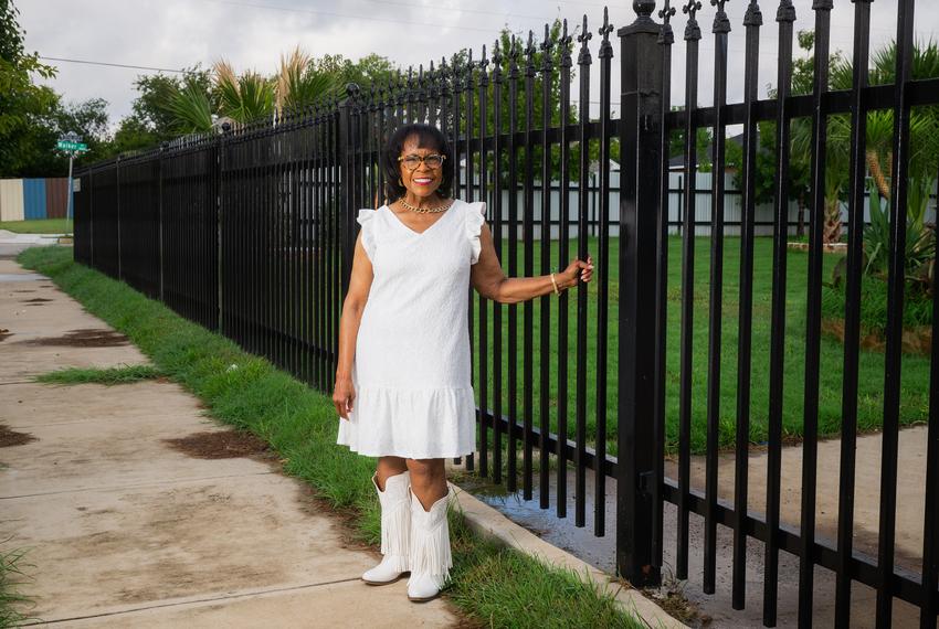 FORT WORTH, TEXAS — SEPTEMBER 1, 2025: Gyna Bivens, a former Fort Worth City Council member representing District 5 and former mayor pro tem, poses for a portrait outside a residence in the Stop Six neighborhood of Fort Worth, Texas, on Monday, Sept. 1, 2025. Ms. Bivens played a key role in shaping zoning laws, including overturning historic overlay zoning to encourage new housing development in her district. CREDIT: Desiree Rios for The Texas Tribune