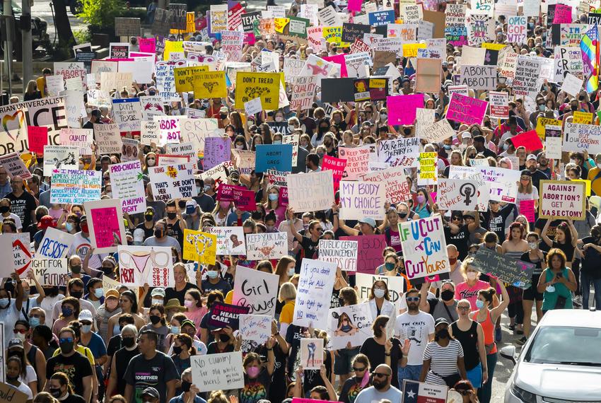 Thousands of participants march and with signs during the 2021 Women’s March on Texas in downtown Houston on Saturday, Oct. 2, 2021.