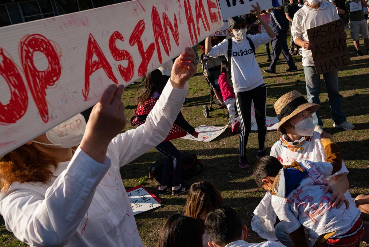 Amanda Zhang, right, attends a rally at Discovery Green on March 20, 2021, in Houston. People gathered for the Stop Asian Hate Vigil and Rally after a man killed eight, including six Asians, in a mass shooting at three Atlanta spas.