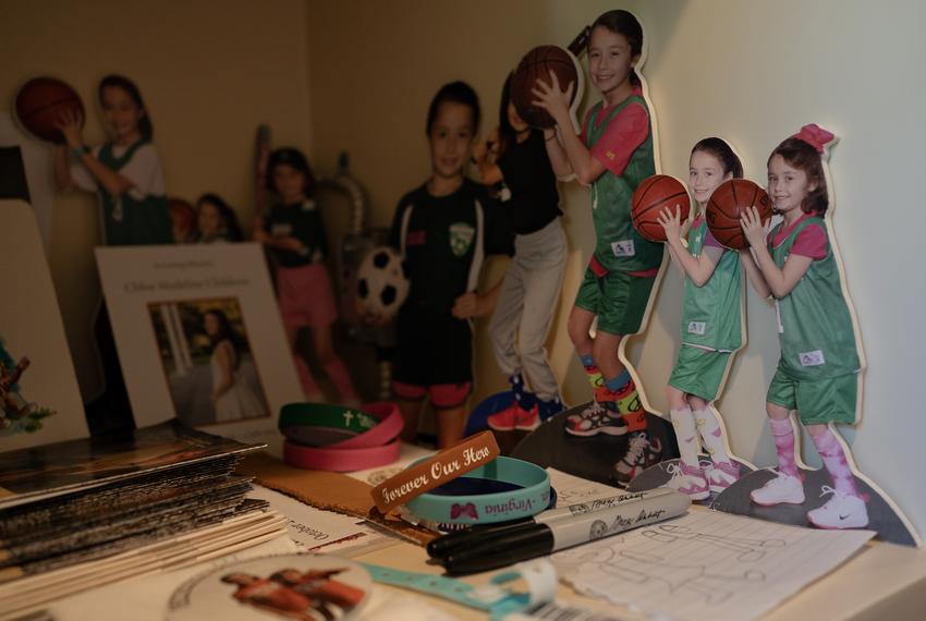 Pictures of Chloe Childress, along with sharpies used during the flood bill signing, in a cubby located in the closet of her father, Matthew, where he keeps mementos of her and his son, photographed at their home in Houston, Texas, on September 11, 2025.