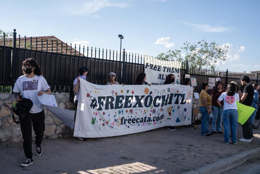 Protesters hold signs up during a rally for the release of Catalina “Xochitl” Santiago, a DACA recipient who was detained by immigration agents at El Paso International Airport in August, outside of the El Paso Service Processing Center, an immigration detention center in El Paso on Wednesday, Sept. 10, 2025.