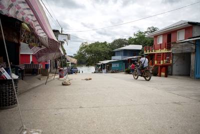The main street in La Tecnica, Guatemala on Nov. 17, 2019. The street leads to a boat ramp on the Usumacinta river, which forms an international border with Mexico. 