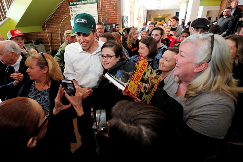 Democratic 2020 U.S. presidential candidate and former U.S. Representative Beto O'Rourke is surrounded by audience members at a campaign stop at Plymouth State University in Plymouth, New Hampshire, U.S., March 20, 2019.