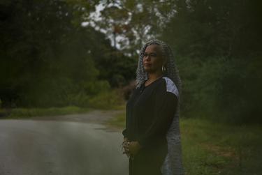 Dena Hughes, the CEO of TAN Healthcare, poses for a portrait as patients receive healthcare at a mobile health clinic in Kirbyville on Oct. 17, 2022.
