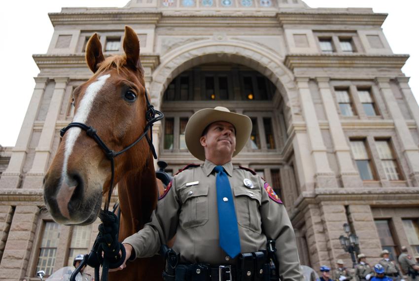 Texas Department of Public Safety officer Michael Knight and his horse Ranger stand by as the Texas DPS announces the launch of a new Mounted Horse Patrol Unit, which will be assigned to the Capitol Complex. May 6, 2014.