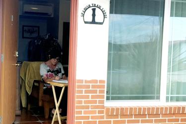 Fort Stockton teacher Staci Ely works in her room at the Spanish Trail Lodge.