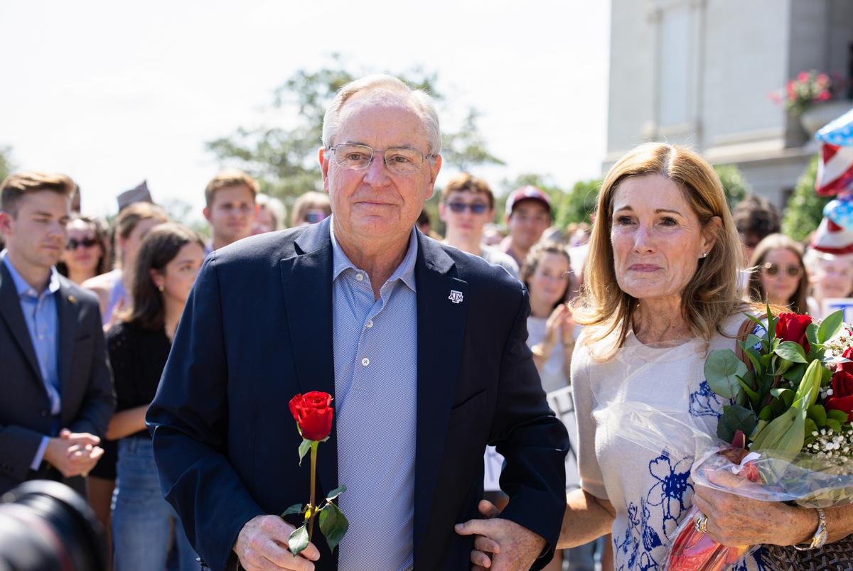 President Mark A. Welsh III and his wife Betty are greeted by A&M faculty and students as he leaves campus after resigning on Sept. 19, 2025.