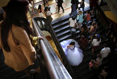 Eliana Peña wears her quinceañera dress for a photo shoot at the Texas Capitol on May 26, 2019.