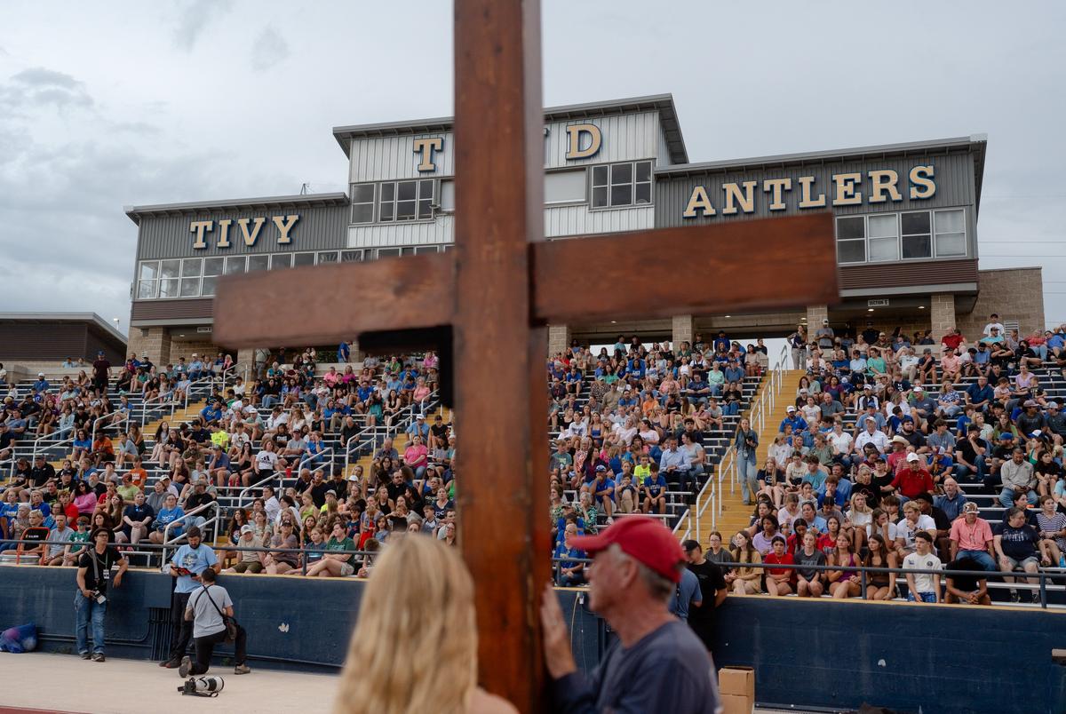 Community members attend a vigil for the victims of the floods at the Antler Stadium in Kerrville on Wednesday July 9, 2025.