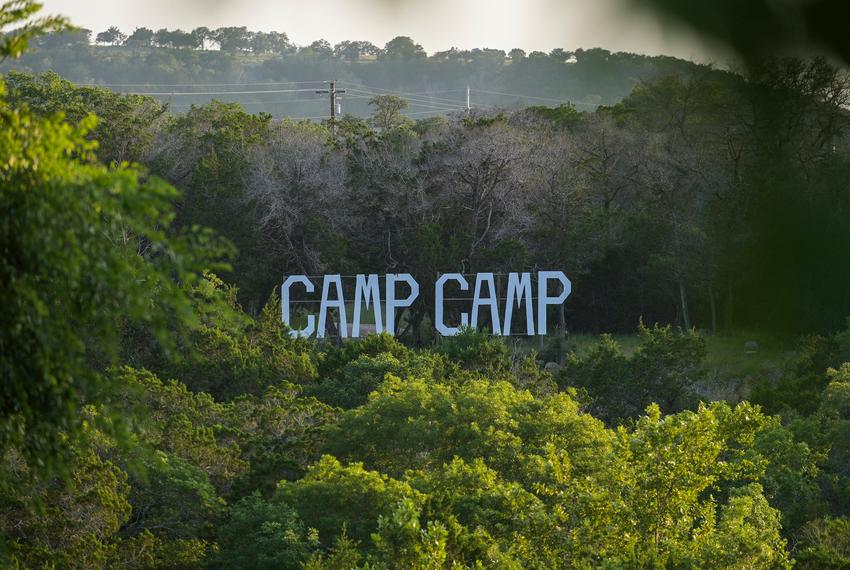 A large sign saying “Camp Camp” overlooks the camp in Center Point on June 13, 2025. CAMP, or Children’s Association for Maximum Potential, began in 1979 when a group of US Air Force pediatricians, along with other health professionals, brought 32 children with disabilities together for a weekend camp.