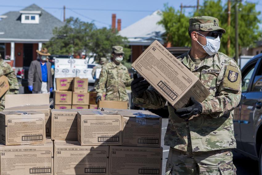 Members of the National Guard hand out food at the Kelly Memorial Food Pantry in Central El Paso during the Coronavirus pandemic. April 7, 2020. 