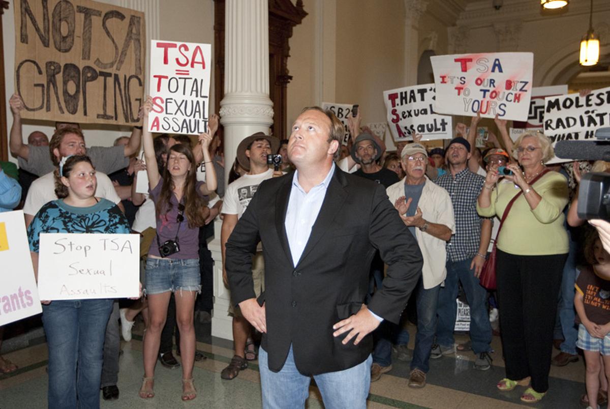 Rally organizer Alex Jones stands with anti-TSA protesters outside the House chamber after the House tentatively passed HB41 airport anti-groping legislation on June 27, 2011.