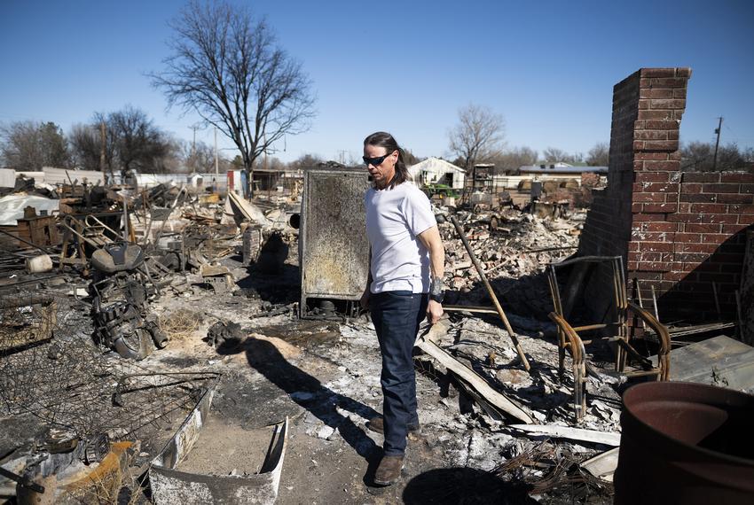 Scott McBroom walks through the rubble of his burned house Friday, March. 1, 2024, in Fritch, Texas.