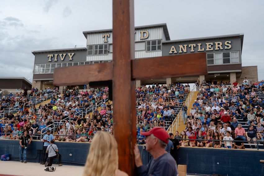 Community members attend a vigil for the victims of the floods at the Antler Stadium in Kerrville on Wednesday July 9, 2025.