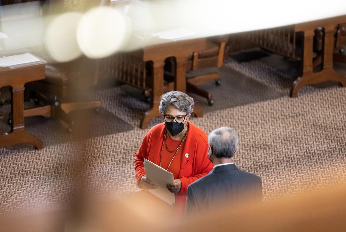Rep. Senfronia Thompson, D-Houston, speaks with a colleague on the house floor on Thursday, April 22,, 2021.
