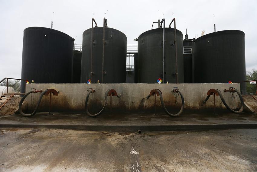 Each day, dozens of trucks hook up to the Gulf Coast-run fracking fluid disposal well site near Gonzales, Texas.