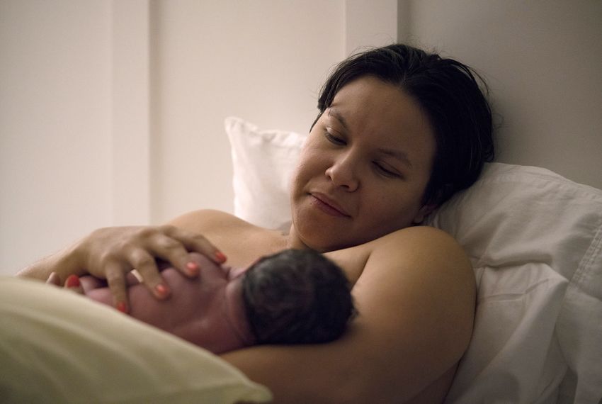 Arika Rodriguez feeds her son, Parker, after giving birth at the Holy Family Birthing Center in Weslaco.