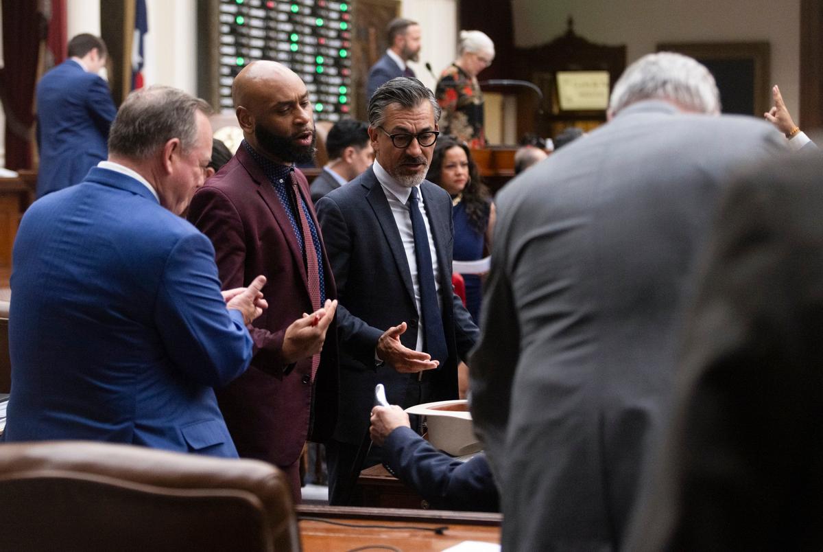 Rep. Christian Manuel, D-Port Arthur, speaks with another representative on the House floor on May 15, 2025. May 15 was the final day for the House to file bills, with the hard deadline at midnight.
