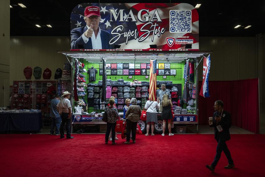 Conventioneers browse a Donald Trump-themed clothing stand at the Texas GOP Convention Thursday, May 23, 2024 in San Antonio.