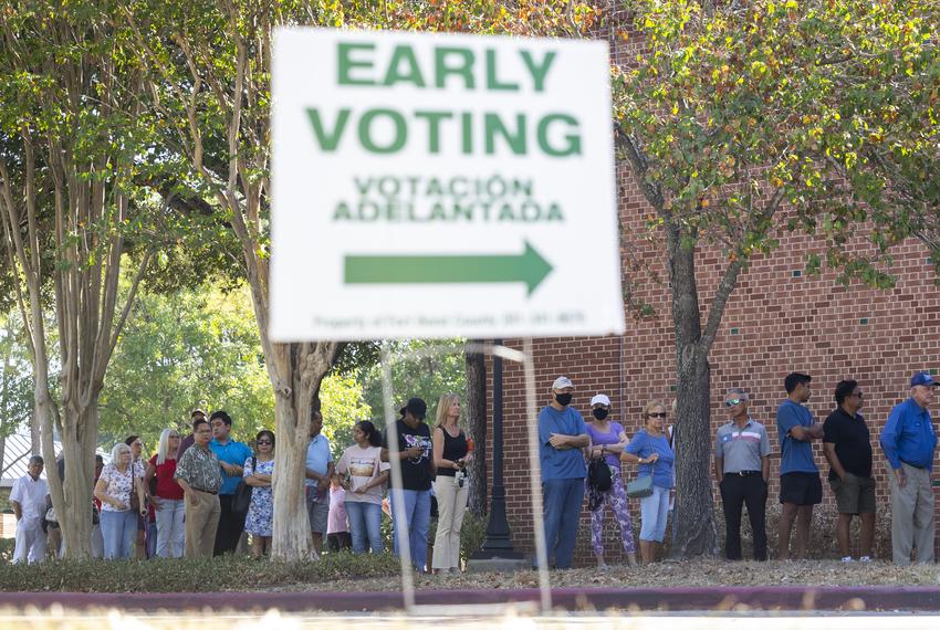 The line wraps around the sidewalk at the Cinco Ranch Branch Library on Monday, Oct. 21, 2024, in Ft Bend County.