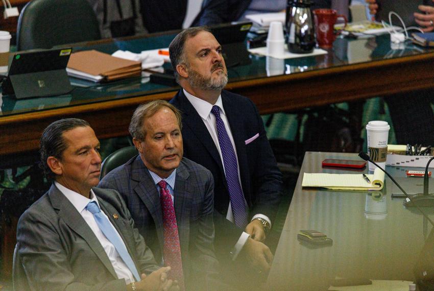 Ken Paxton sits with attorneys Tony Buzbee and Mitch Little on the ninth day of suspended Attorney General Ken Paxton’s impeachment trial at the state capitol in Austin, Texas, on Sept. 15, 2023.