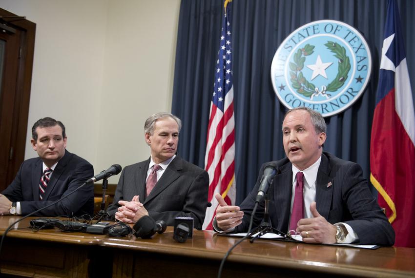 Attorney General Ken Paxton, r, with U.S. Sen. Ted Cruz and Gov. Greg Abbott during the press conference praising federal Judge Andrew S. Hanen's immigration ruling on Feb. 18, 2015.