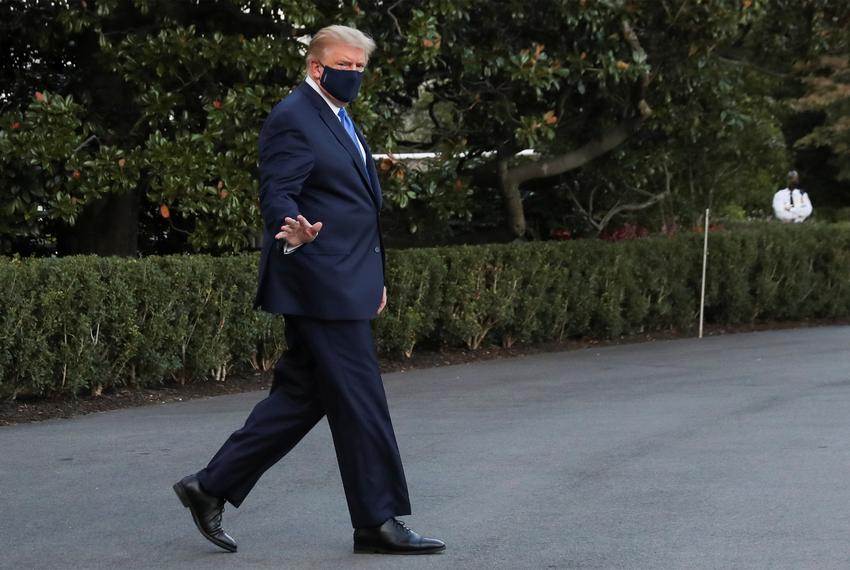 President Donald Trump waves while walking to the Marine One helicopter to depart the White House to fly to Walter Reed National Military Medical Center, where it was announced he will work for at least several days after testing positive for COVID-19, on the South Lawn of the White House in Washington, D.C. on October 2, 2020.