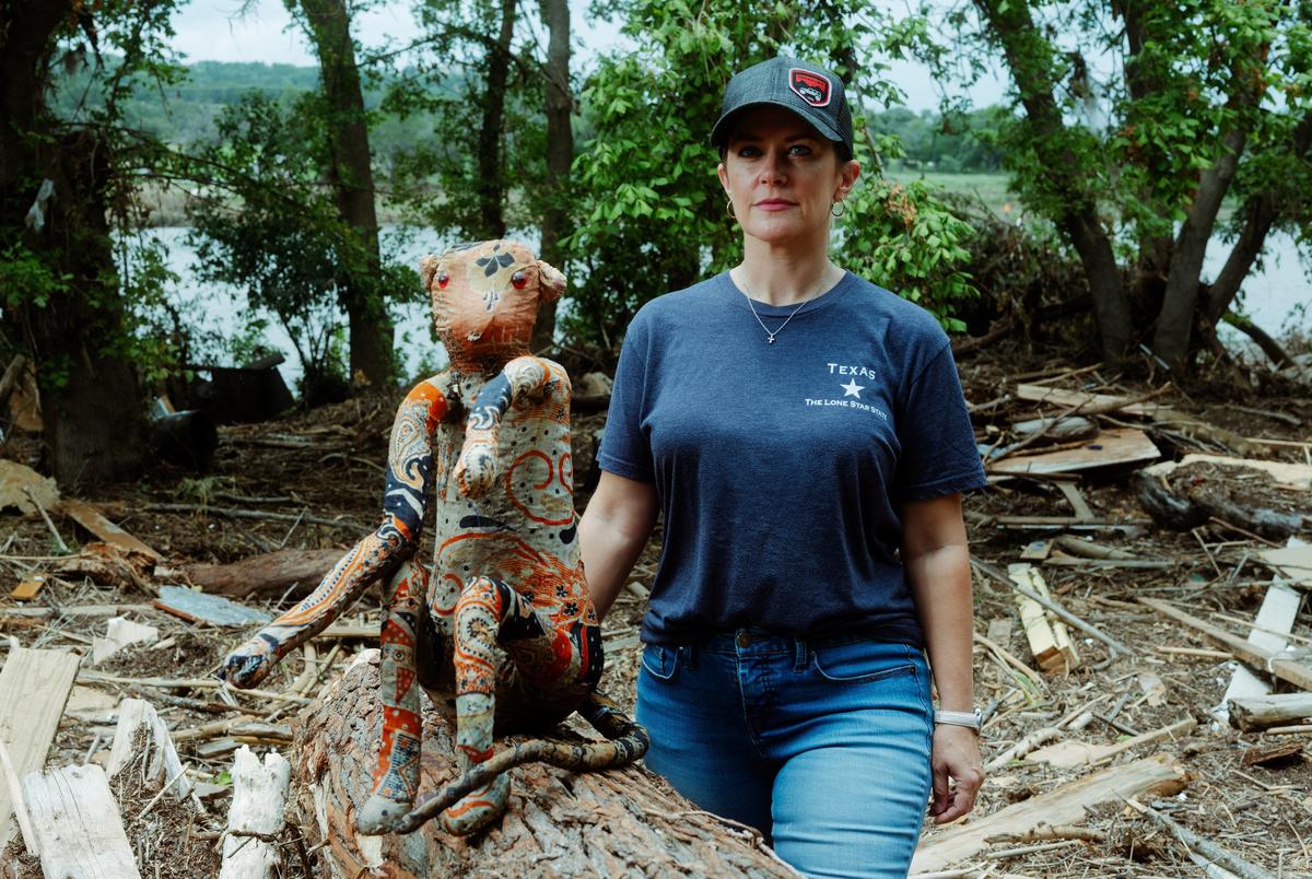 Crystal Smith, co-owner of Billy Gene's Restaurant in Kerrville, next to a stuffed monkey she found on the restaurant’s property.