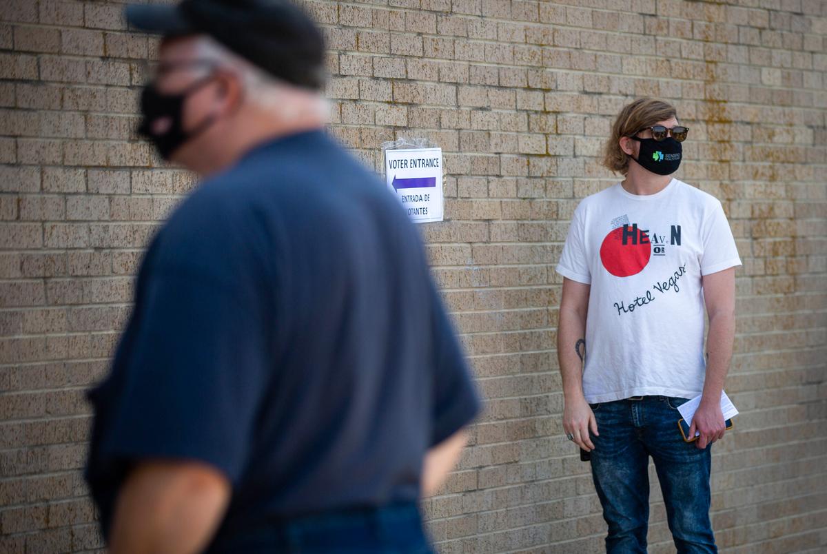 Voters lined up for hours to cast their ballots early at the Manor ISD Administration building on Oct 14, 2020.