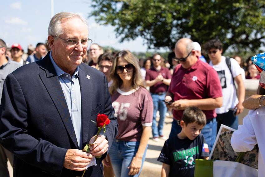 President Mark A. Welsh III and his wife Betty are greeted by A&M faculty and students as he leaves campus after resigning on Sept. 19, 2025.