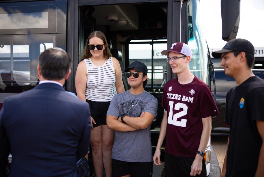 Texas A&M University System Chancellor Glenn Hegar, left, greets Texas A&M University student bus drivers Isabel Nichols, Dylan Tan, Connor Schultz, and Bryan Gonzales during a visit to the RELLIS campus in College Station, Texas, on Tuesday, July 22, 2025. Hegar’s visit to the RELLIS campus was his first since beginning his tenure as chancellor on July 1.