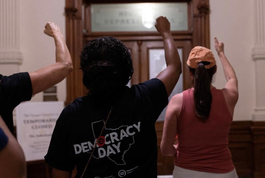 Protesters cheer on state Rep. Nicole Collier, D-Fort Worth, after she chose to remain in the Texas House chamber until Wednesday after Democratic lawmakers who left the state to deny Republicans the opportunity to redraw the state's 38 congressional districts, returned to the Capitol in Austin on Aug. 18, 2025. Collier is staying because she did not want to sign the required permission slip that would allow lawmakers to leave the Capitol under escort by Department of Public Safety agents.