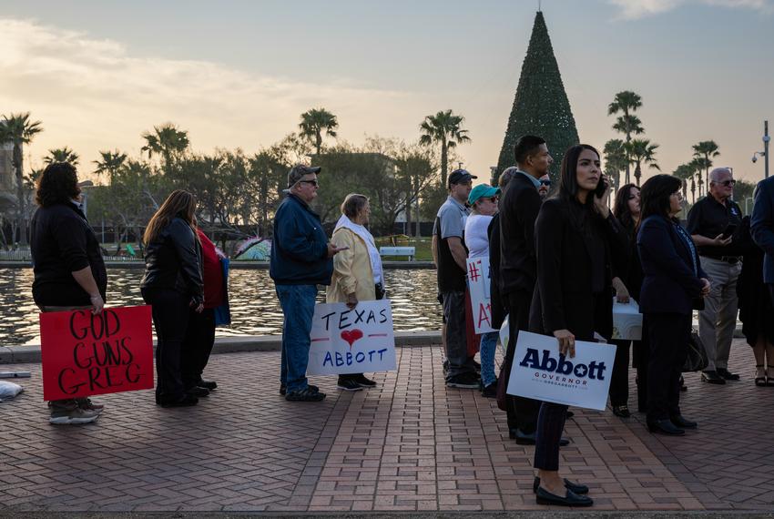 Suporters of Gov. Abbott wait in line at the Hispanic Leadership Summit in McAllen on Jan. 8, 2022 to take a photo with the governor.