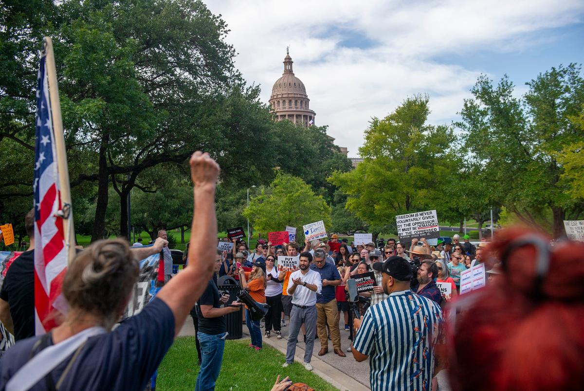 U.S. Rep. Greg Casar, D-Austin, speaks to protestors at a rally outside the Governor's Mansion in Austin on Aug. 4, 2025.